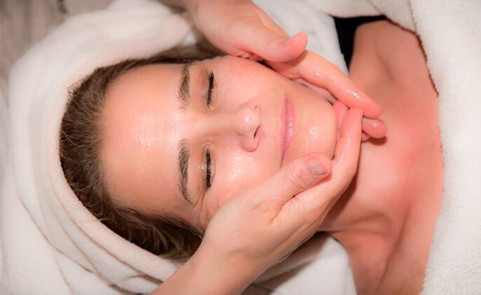 Rejuvenating facial massage with cosmetic oil